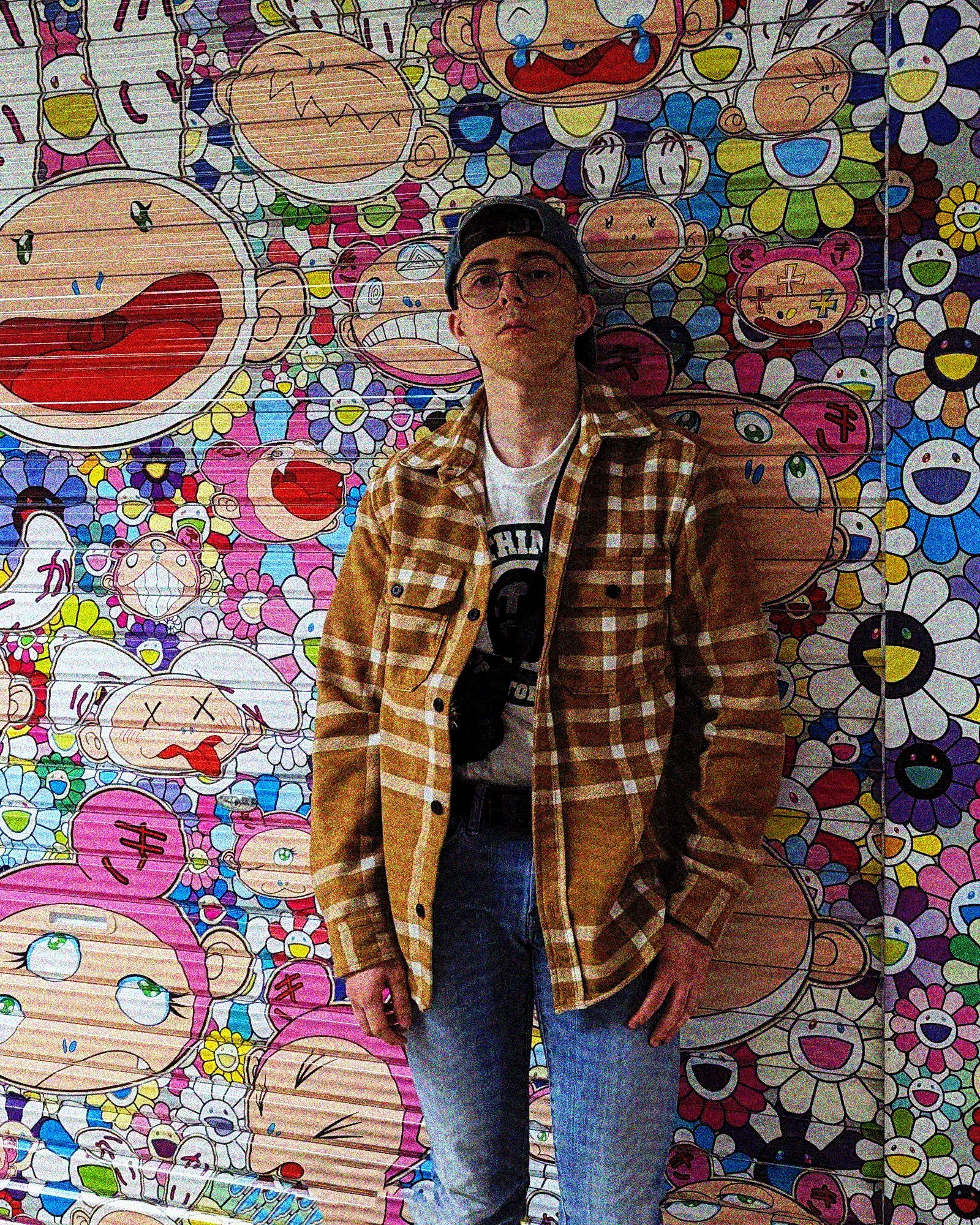 picture of myself in front of a graffitied store front